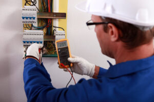 an electrician checking the energy meter