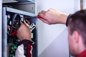 electrician engineer working with electric cable wires